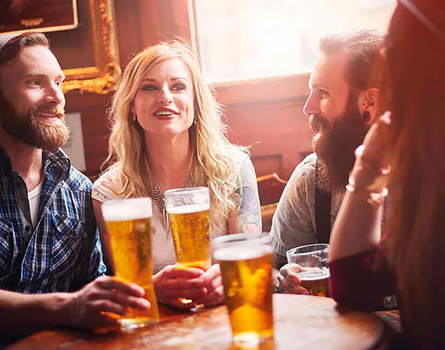 Group of friends laughing at restaurant